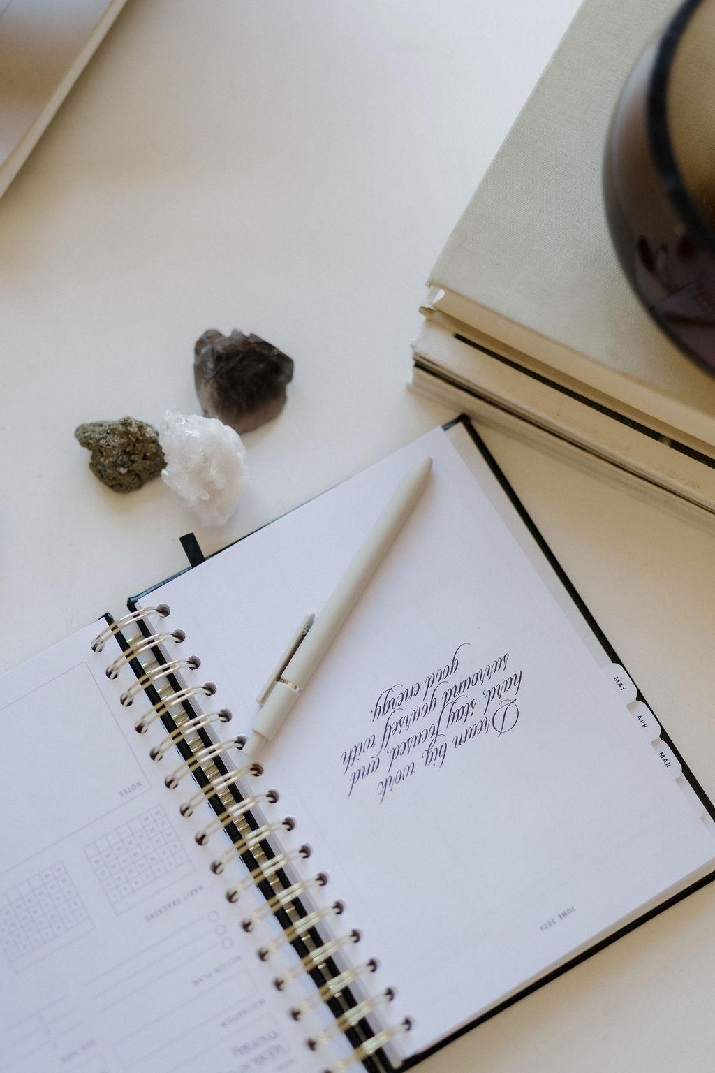 A notebook and pen on a desk